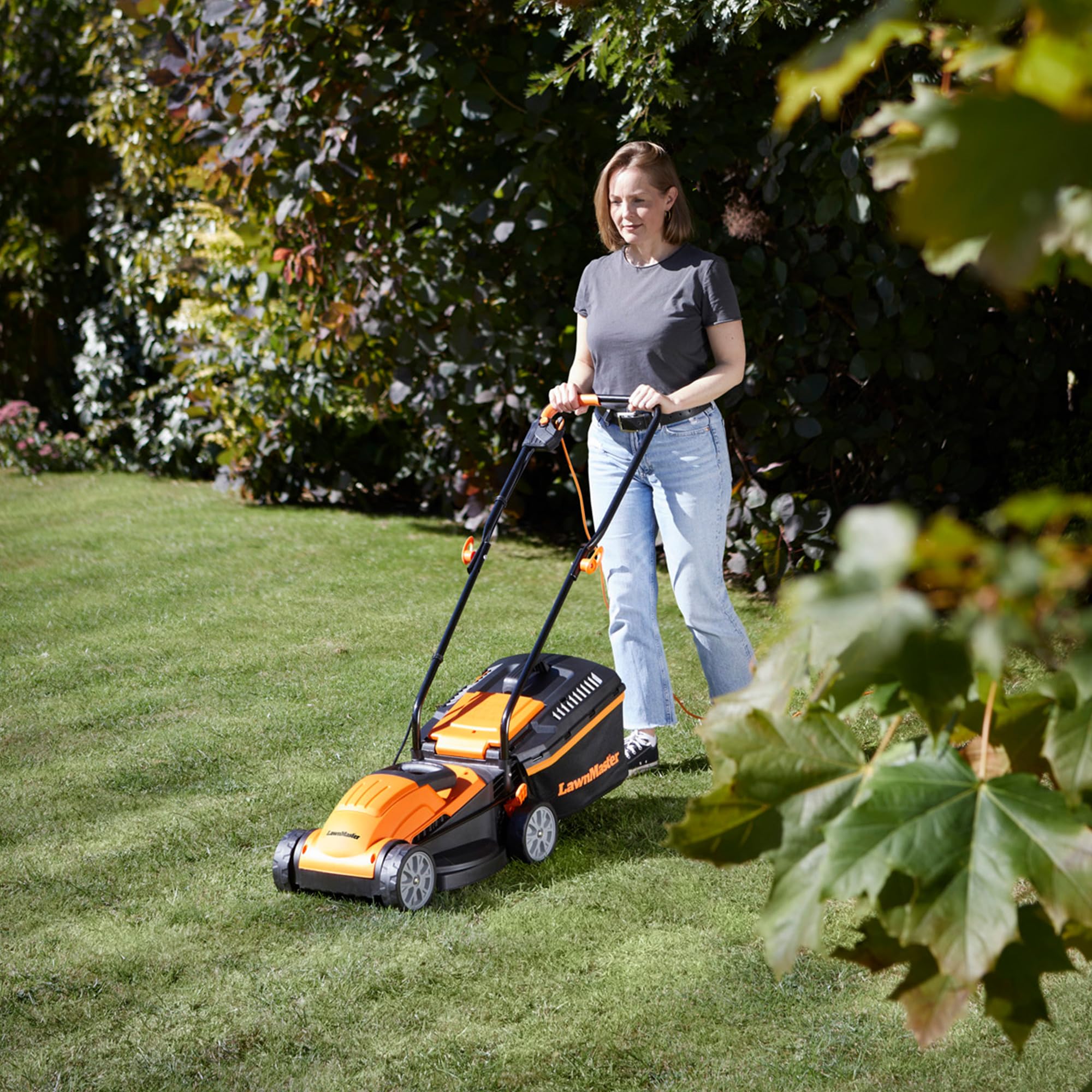 LawnMaster 1200W Electric Lawn Mower with 32cm cutting width, ideal for small lawns. With 5 adjustable cutting heights and rear roller for striped finish, 2 year guarantee